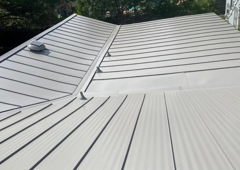Solar attic fan installed on a metal roof for Roof Ventilation in Mecca